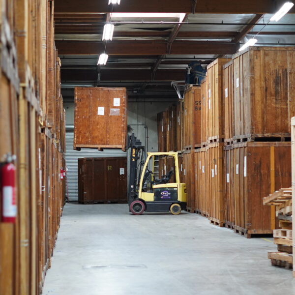 Wooden moving vaults and forklift equipment inside the Vector warehouse