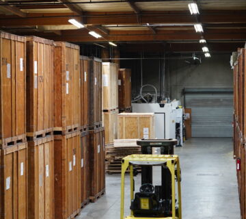 Wooden moving vaults and forklift equipment inside the Vector warehouse