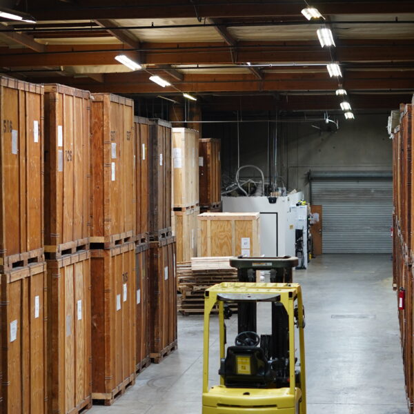 Wooden moving vaults and forklift equipment inside the Vector warehouse