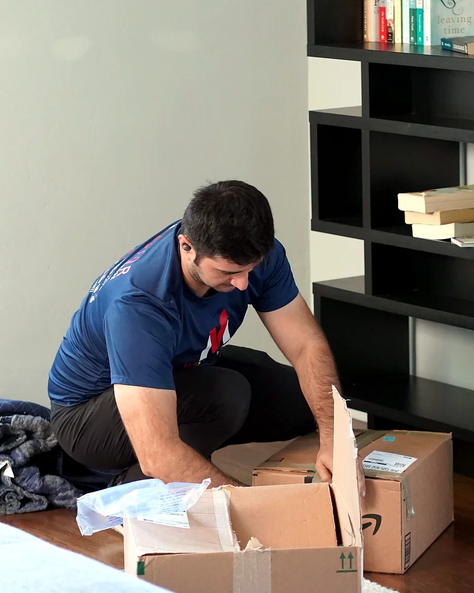 Vector mover packing household belongings before moving day