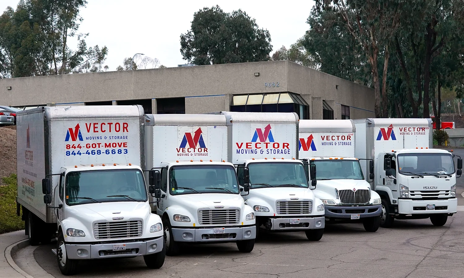 Fleet of branded Vector Moving and Storage trucks