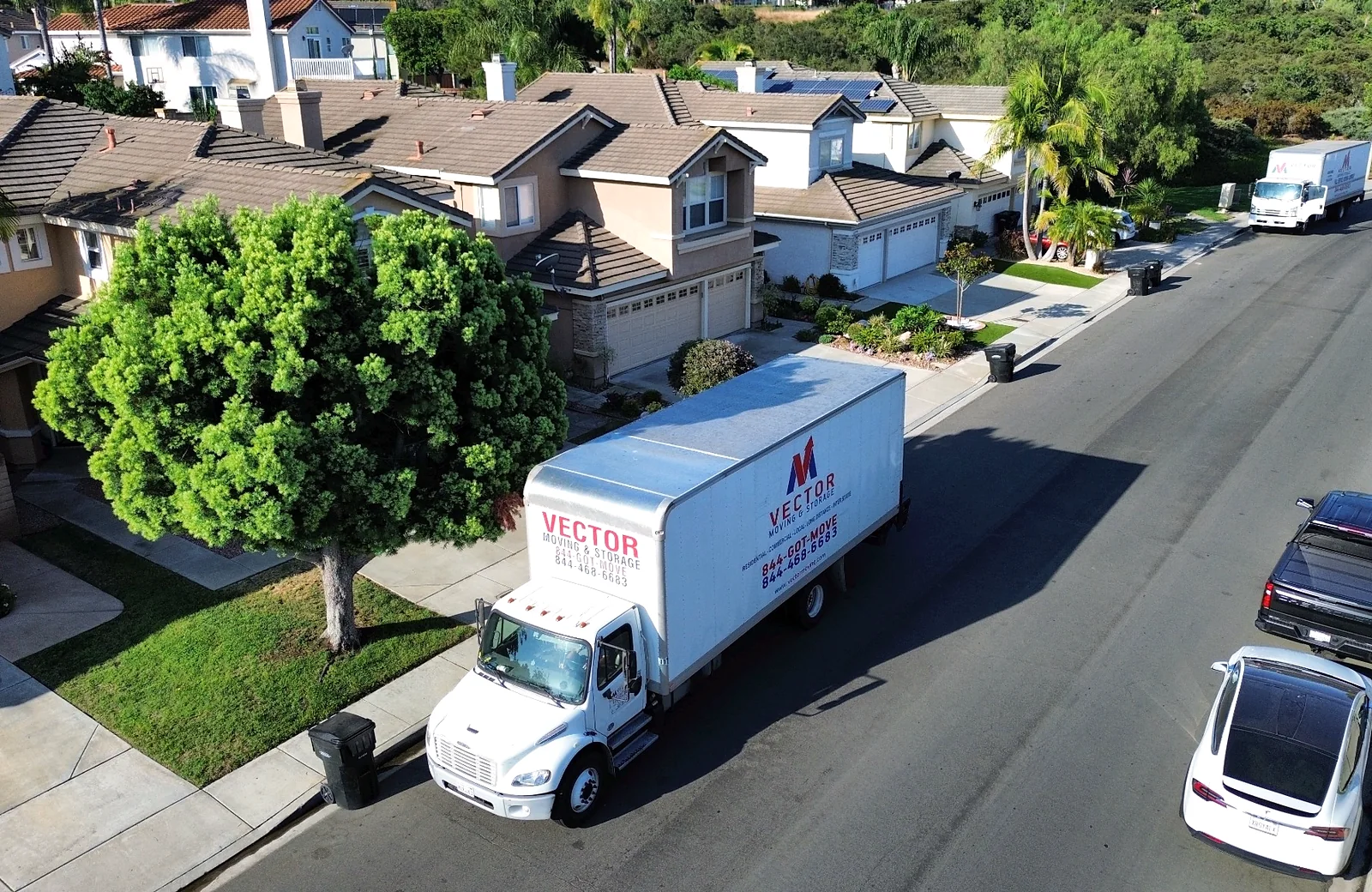 Vector Moving and Storage truck on a residential street