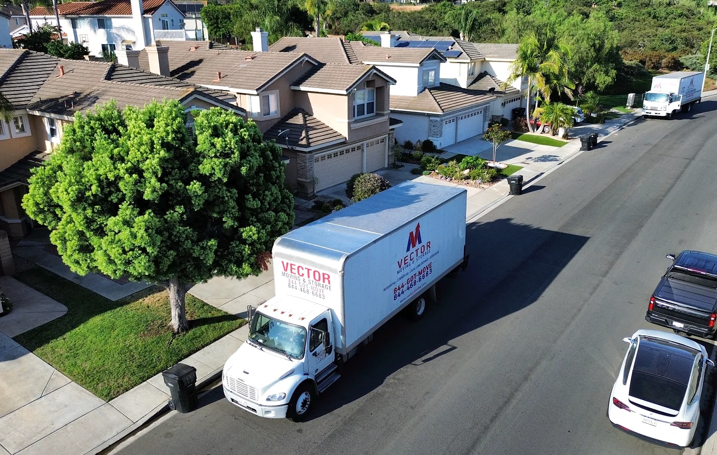 Vector moving trucks on a residential street