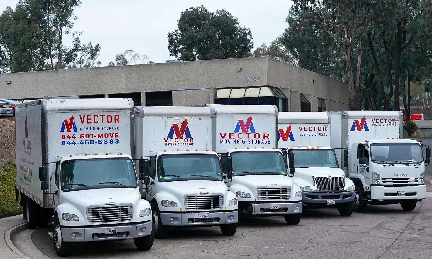 Fleet of branded Vector Moving and Storage trucks