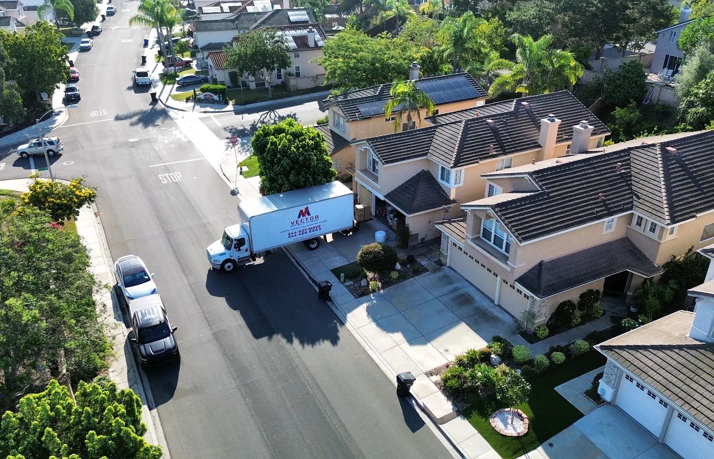 Vector moving truck at a landscaped planned residential community
