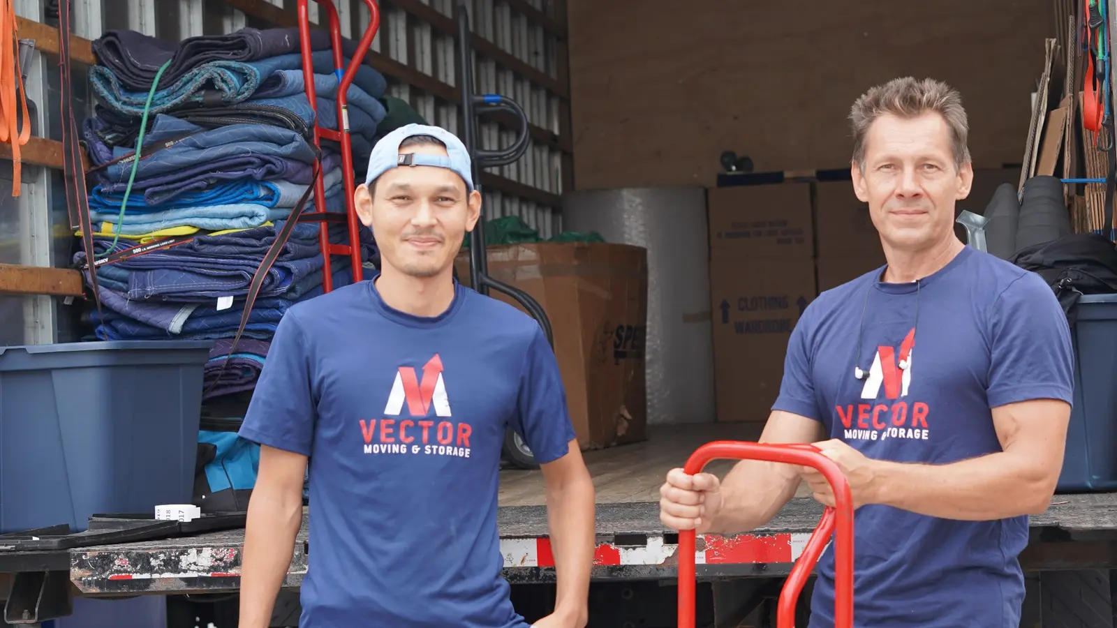 Vector Moving crew with wardrobe boxes prepared for hanging clothes