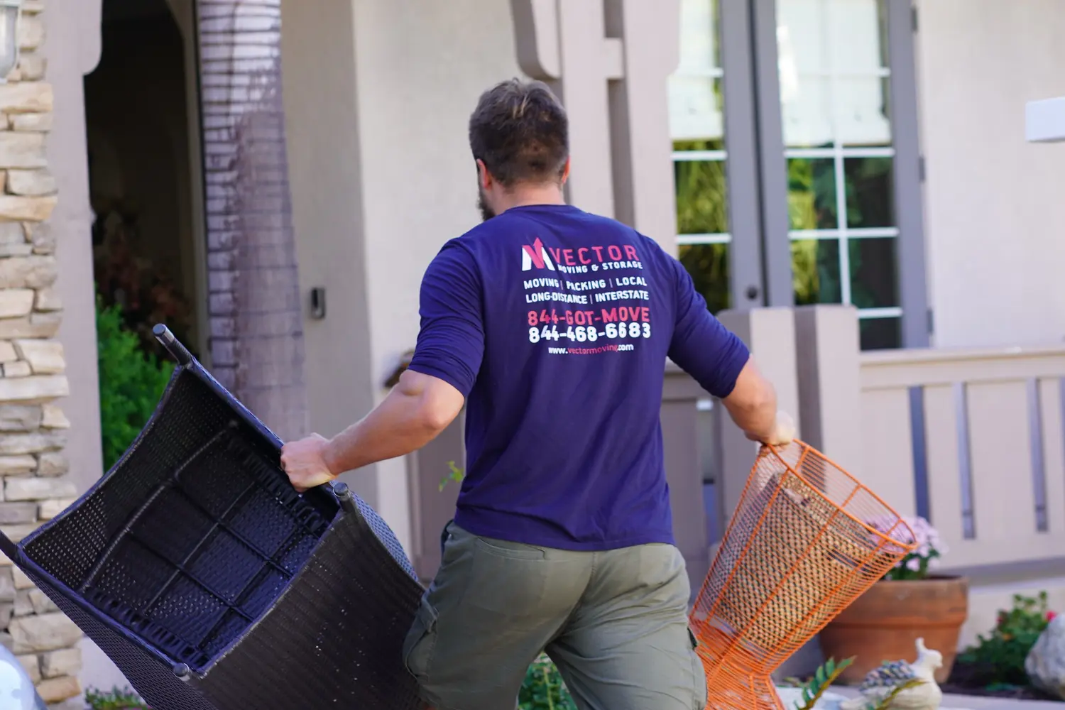 Vector mover carrying outdoor furniture during a residential move