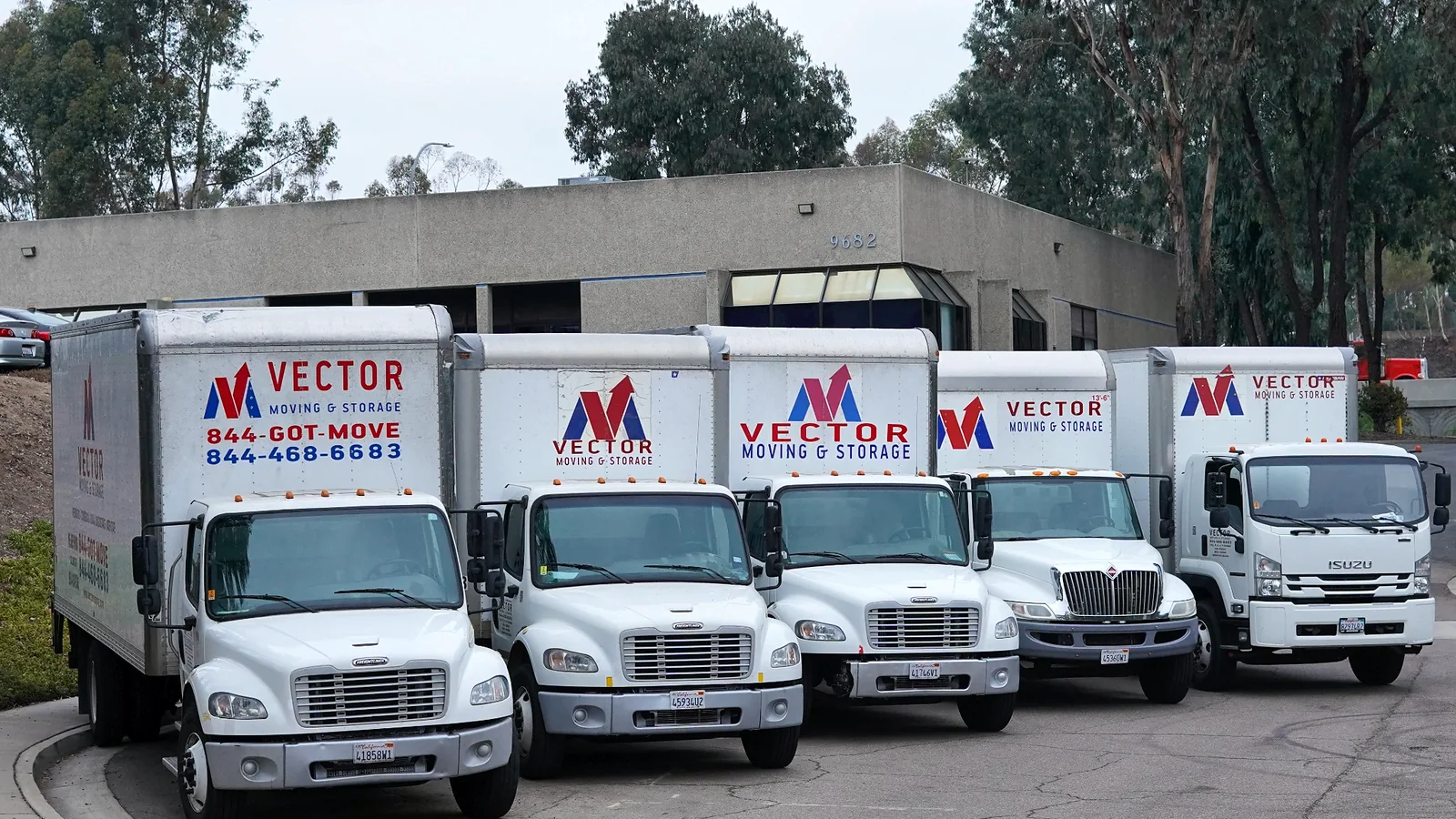 Fleet of branded Vector Moving and Storage trucks in San Diego