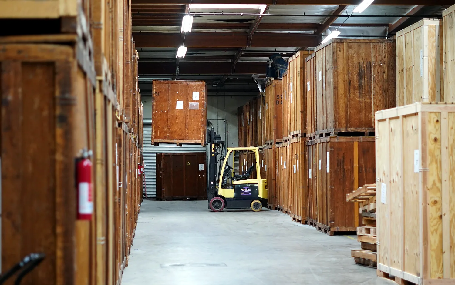 Wooden moving vaults and forklift equipment inside the Vector warehouse