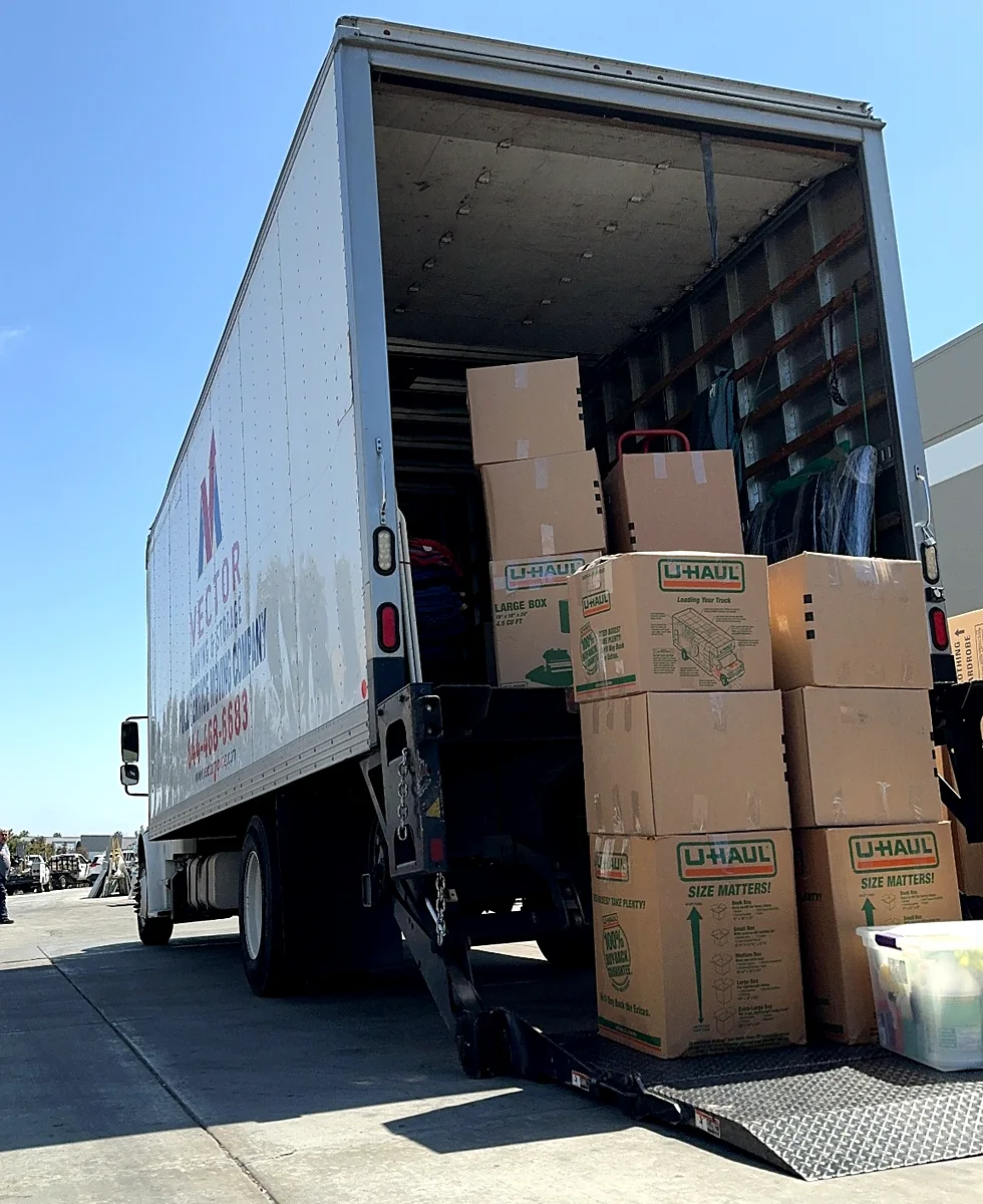 Vector moving truck loaded with labeled boxes for transportation