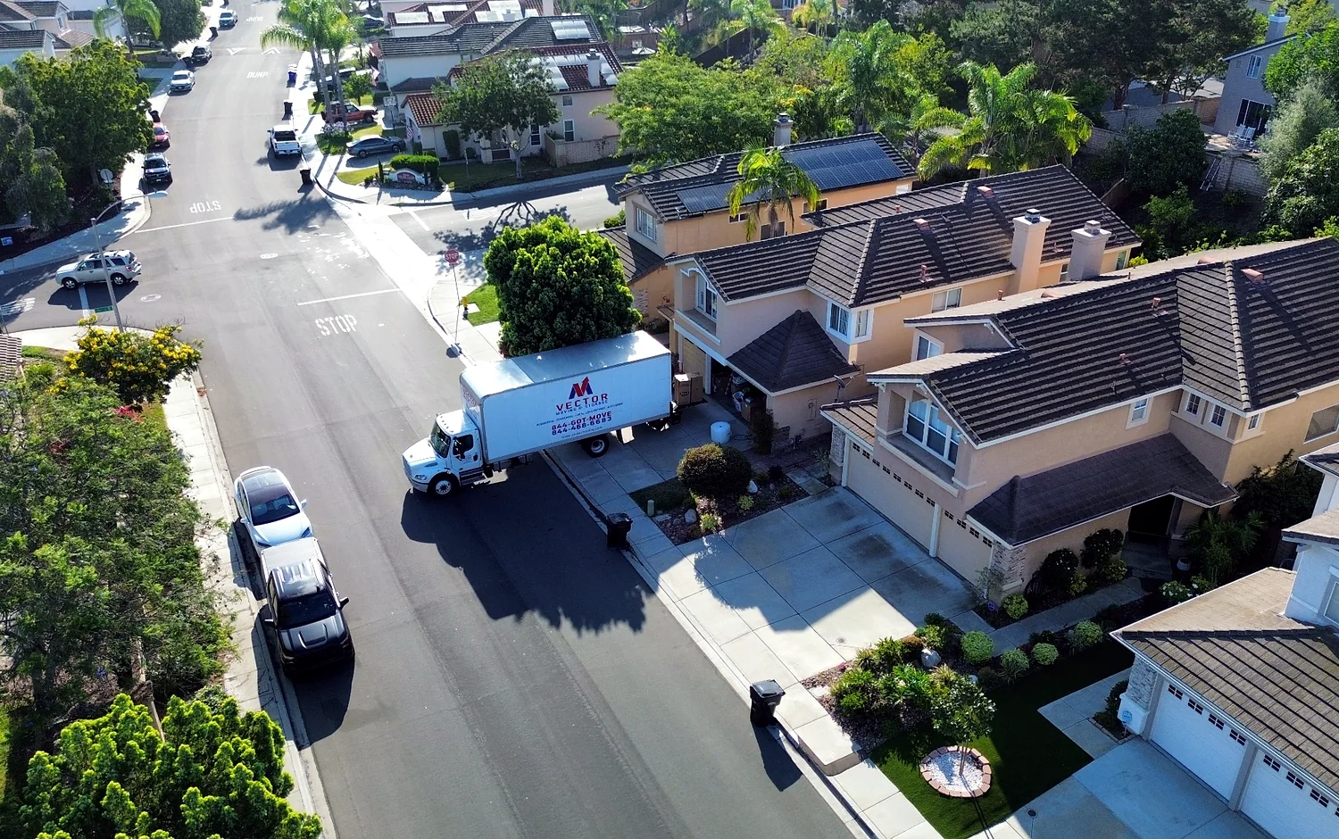 Aerial view of a Vector moving truck serving a planned residential neighborhood