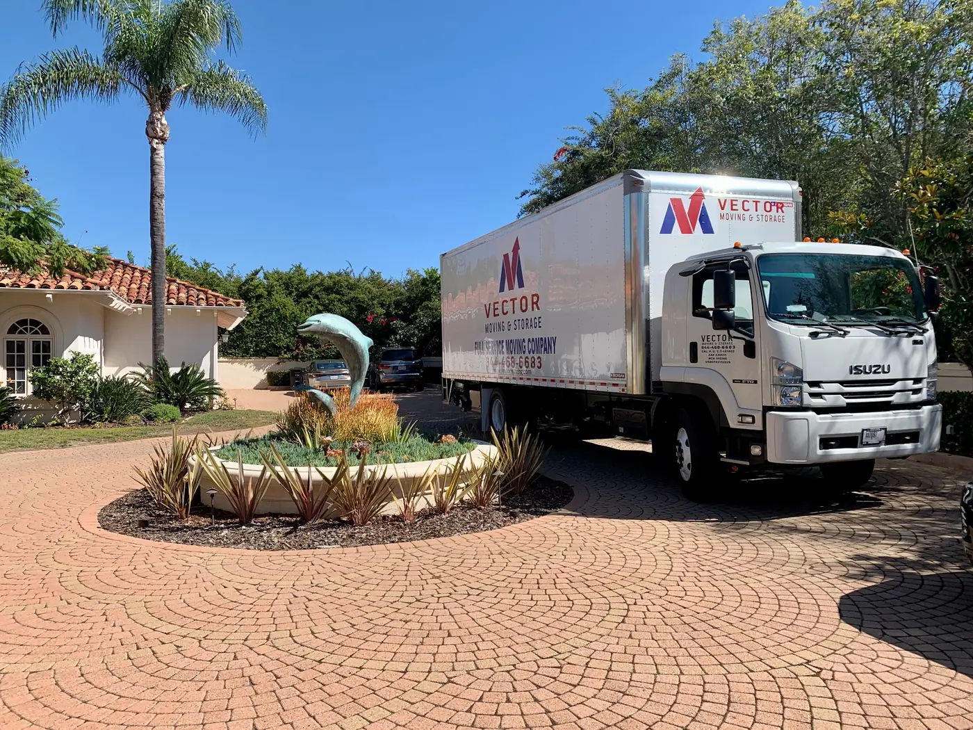 Branded Vector Moving and Storage truck positioned at a San Diego home