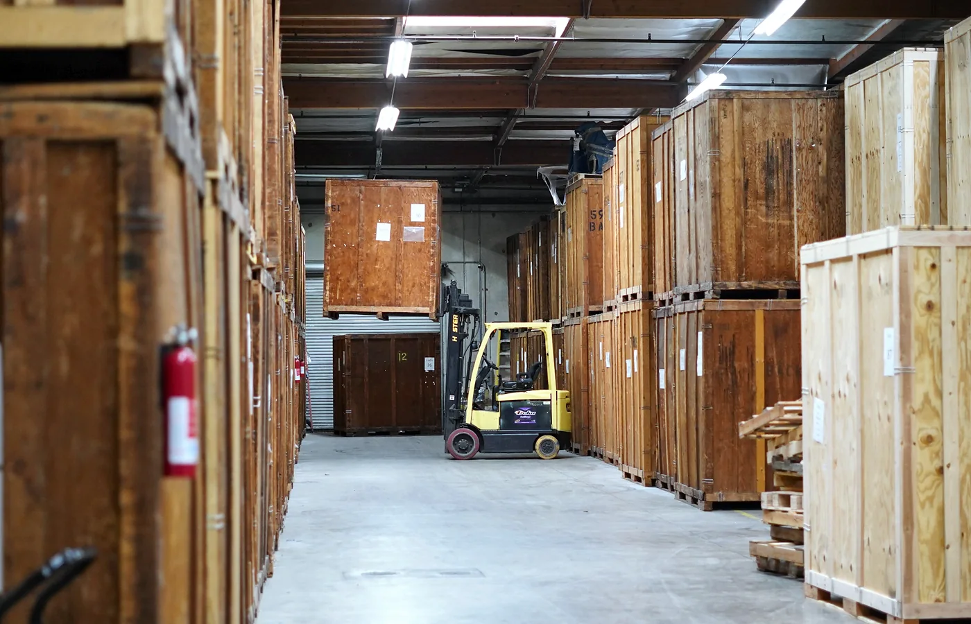 Wooden storage vaults and forklift inside the Vector warehouse