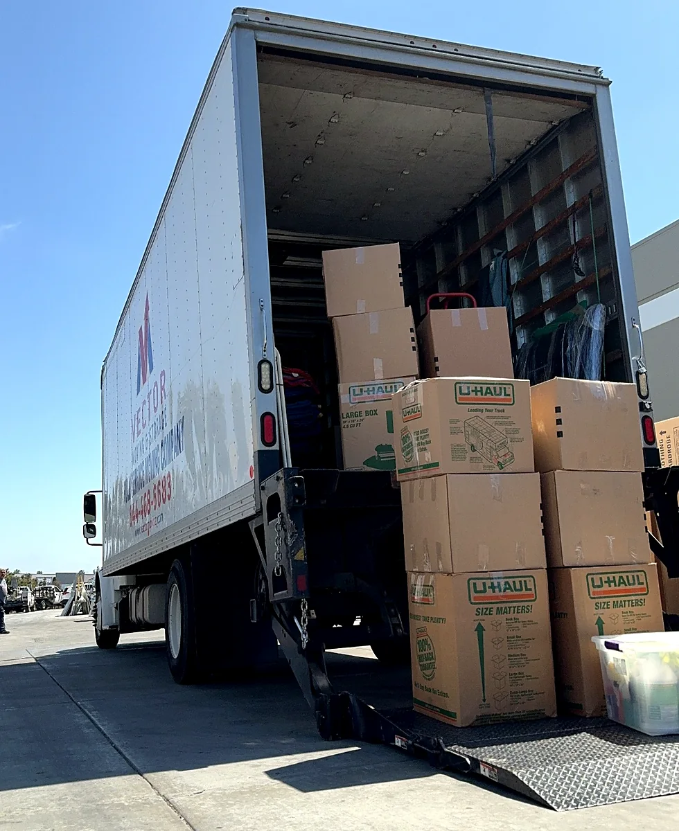 Vector moving truck loaded with labeled boxes for long-distance transportation