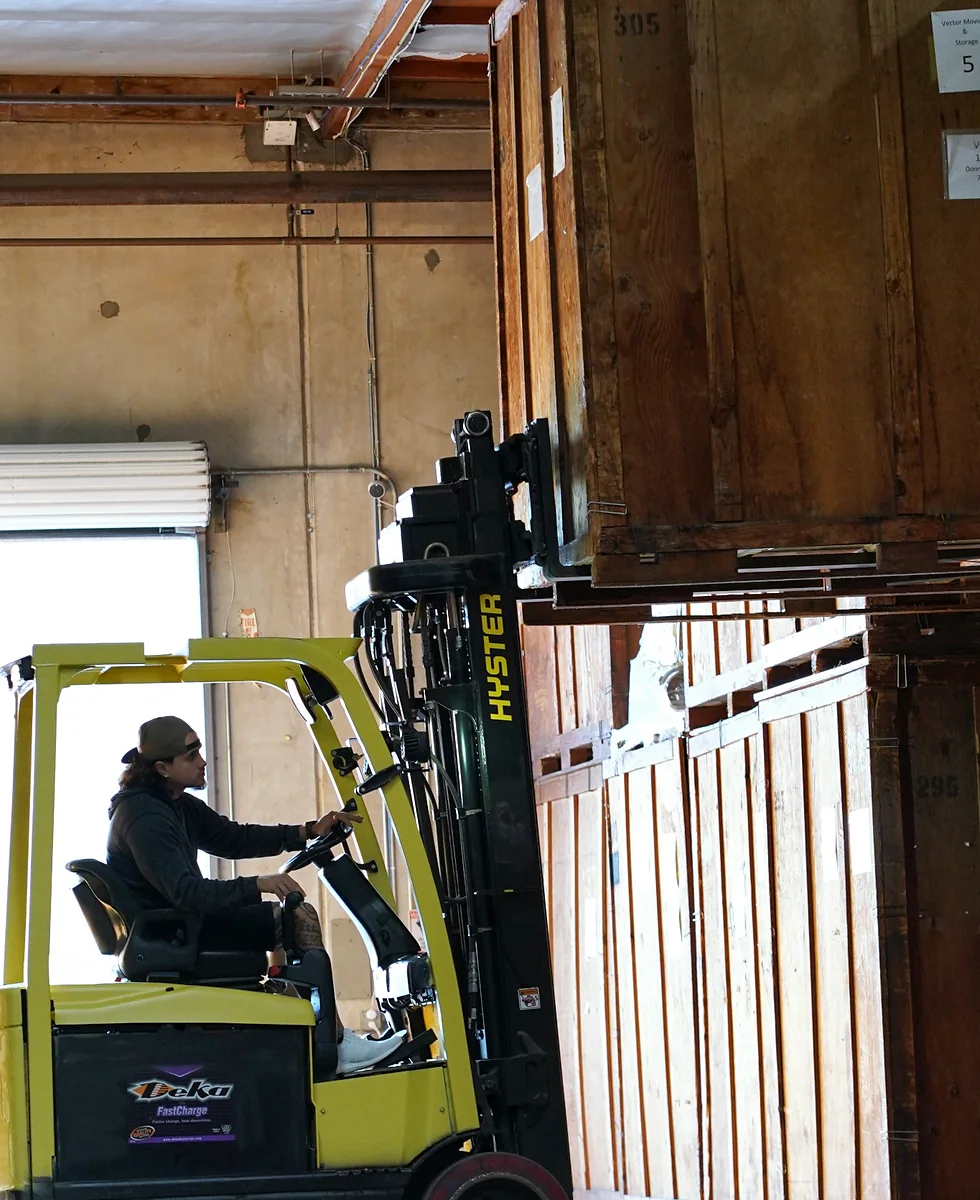 Wooden storage vaults and forklift inside the Vector warehouse