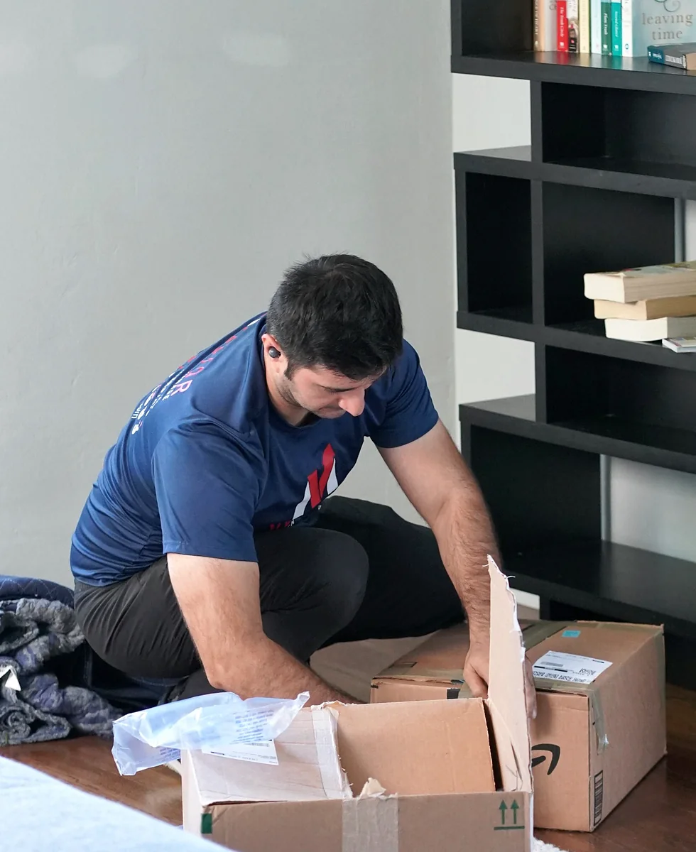Vector mover packing household items before storage