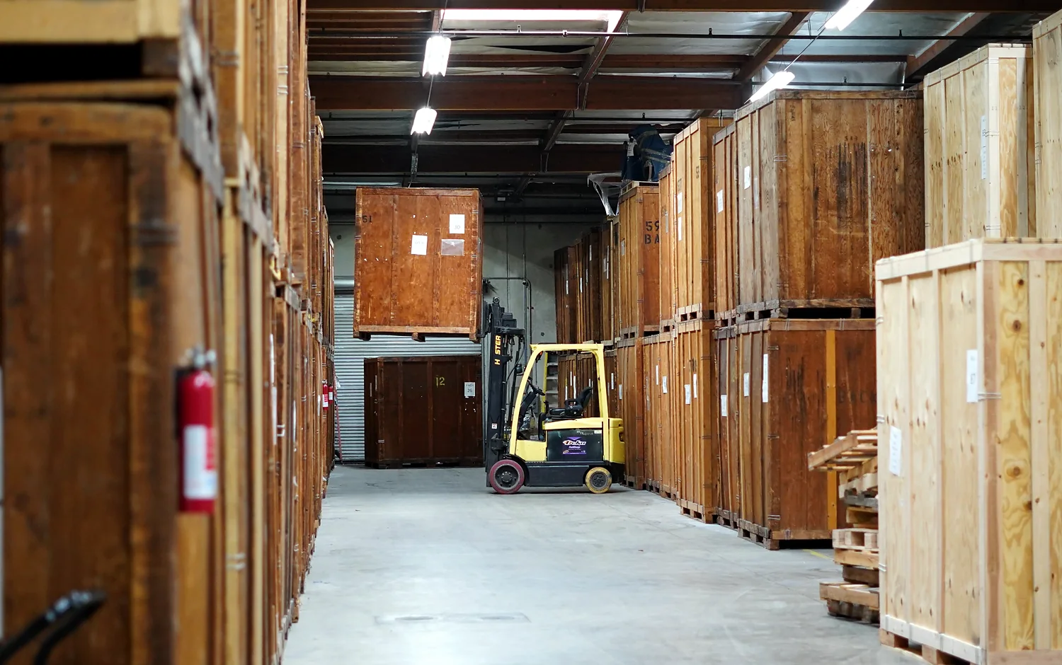 Wooden moving vaults and forklift equipment inside the Vector warehouse