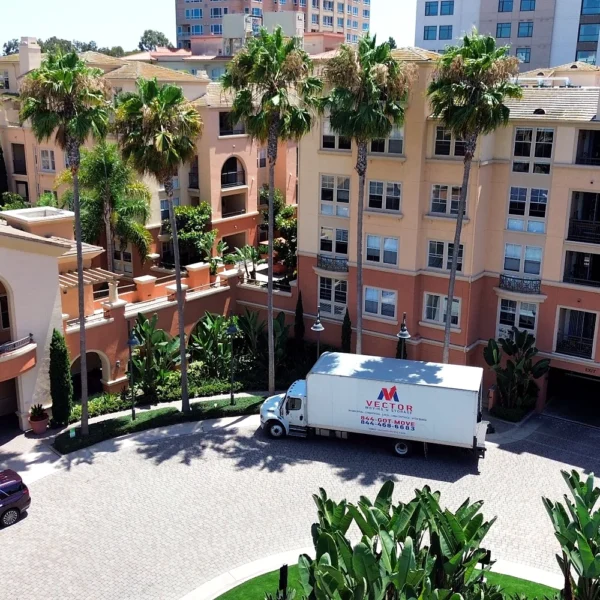Vector Moving and Storage truck positioned at a managed residential community