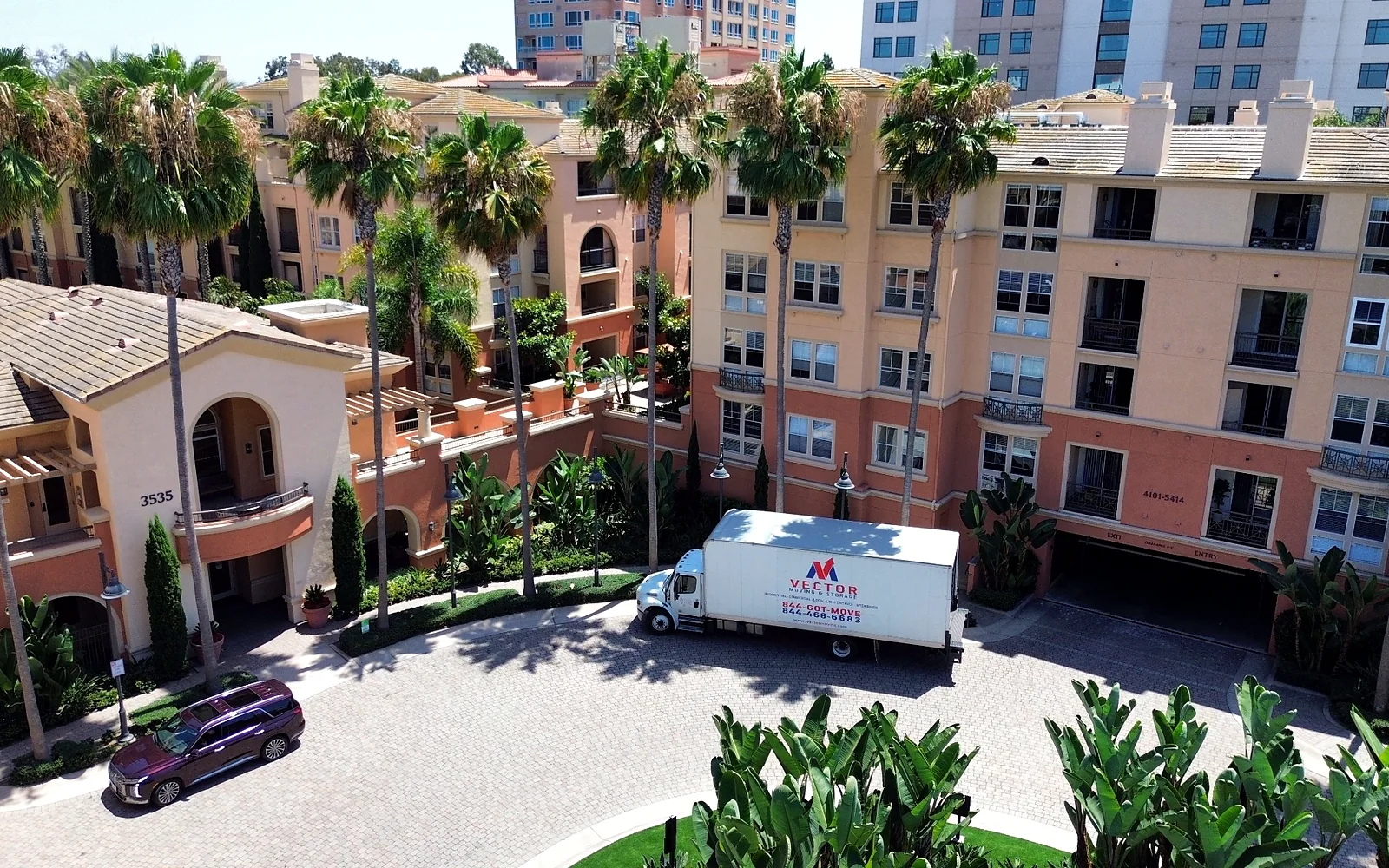 Vector Moving and Storage truck positioned at a managed residential community