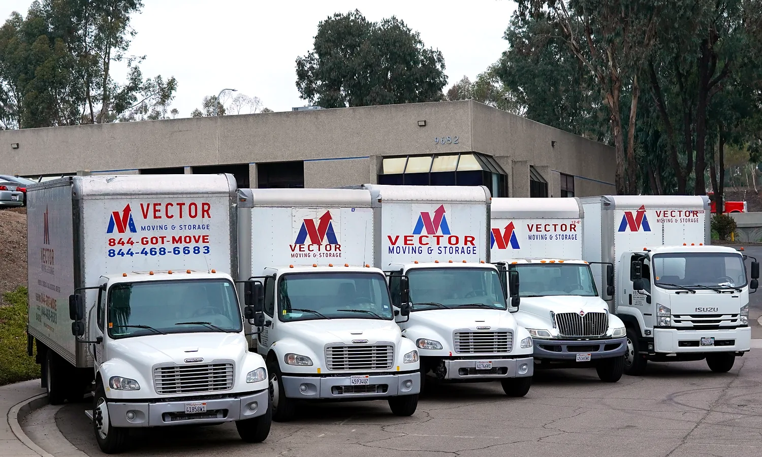 Fleet of branded Vector Moving and Storage trucks
