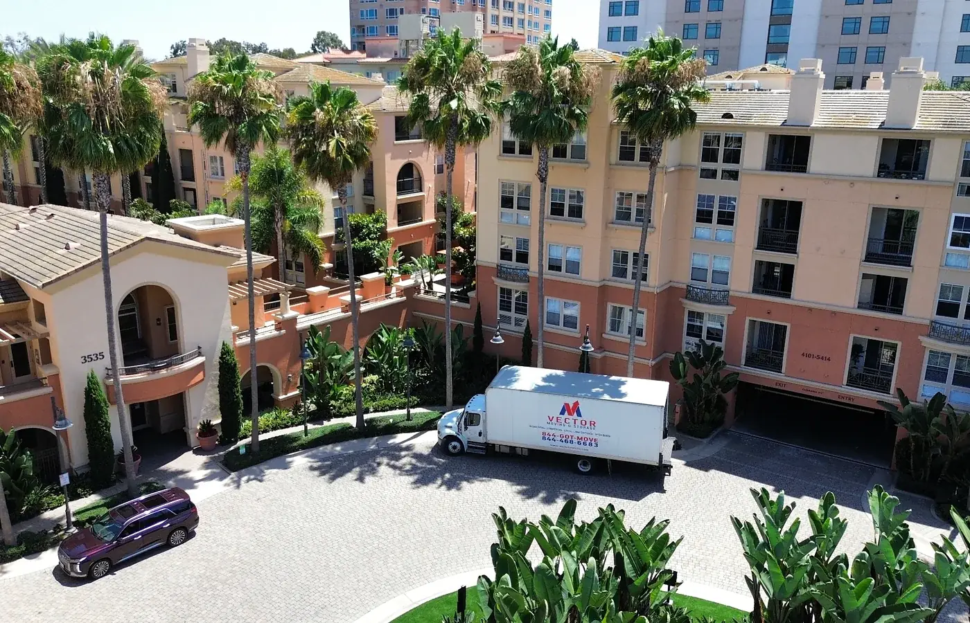 Vector moving truck positioned at an Arizona condominium delivery property