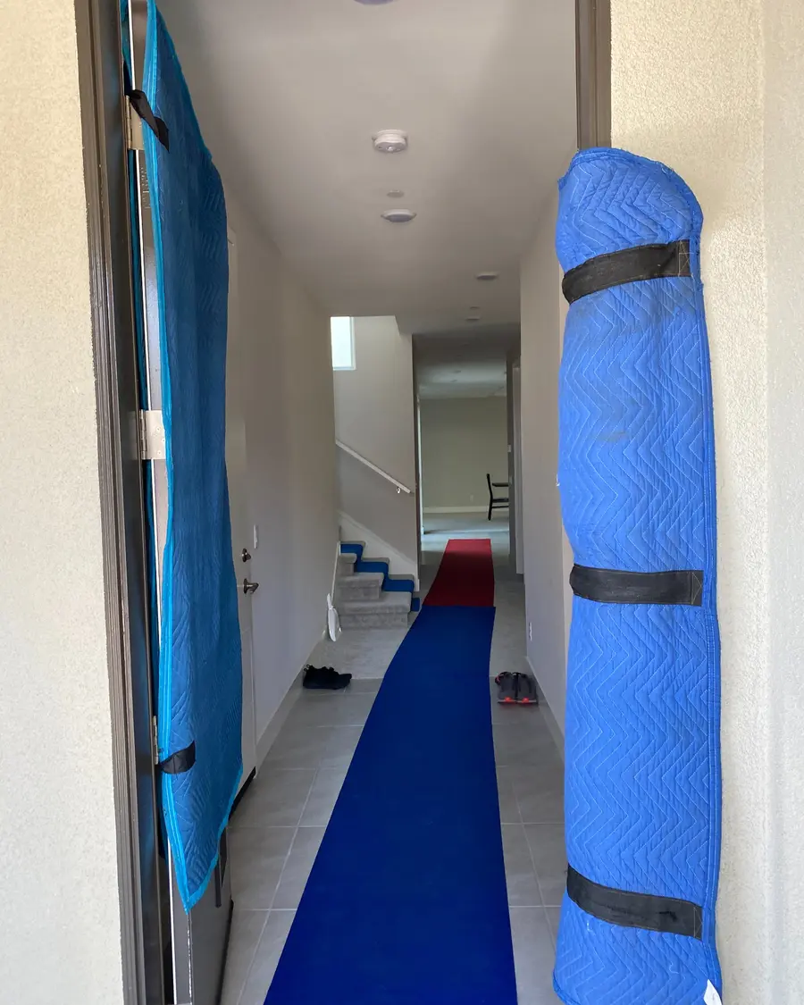 Moving blankets and floor protection at a home entrance