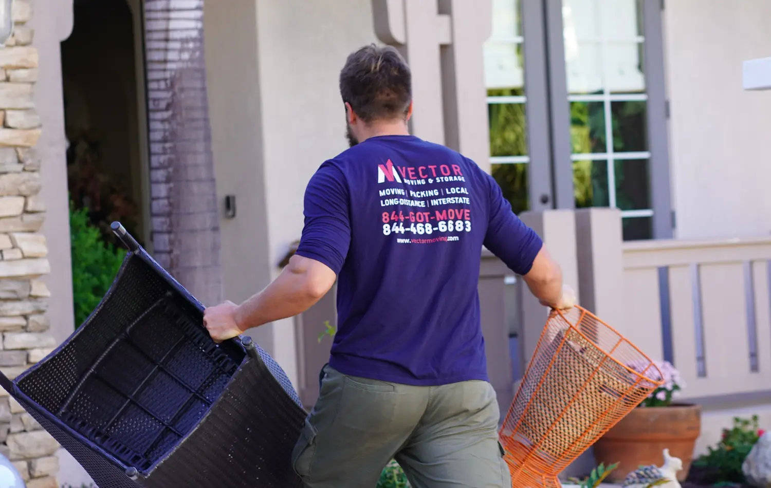 Vector mover carrying household baskets toward a home