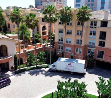 Vector Moving and Storage truck positioned at a multi-unit residential property