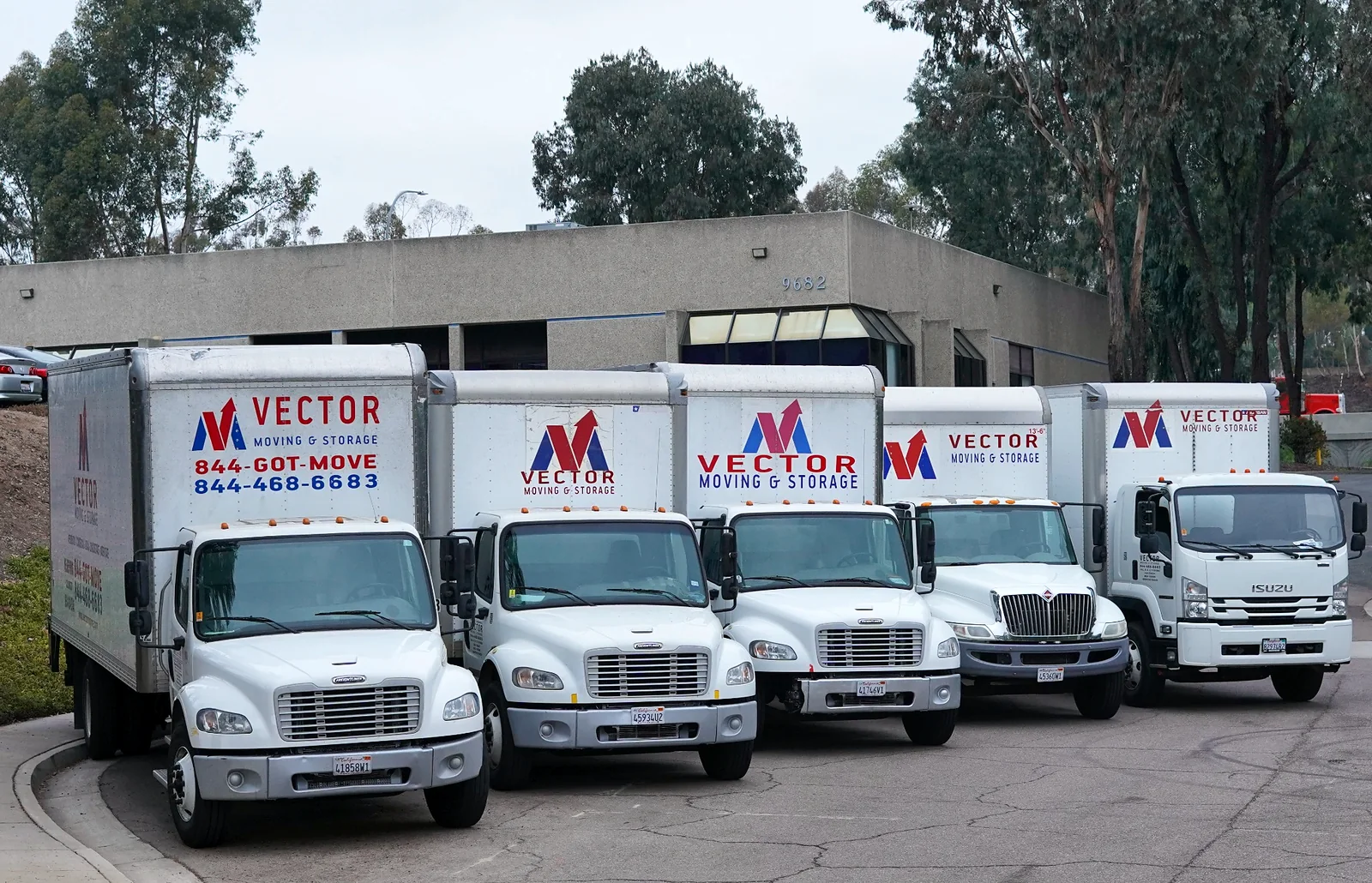 Fleet of branded Vector Moving and Storage trucks