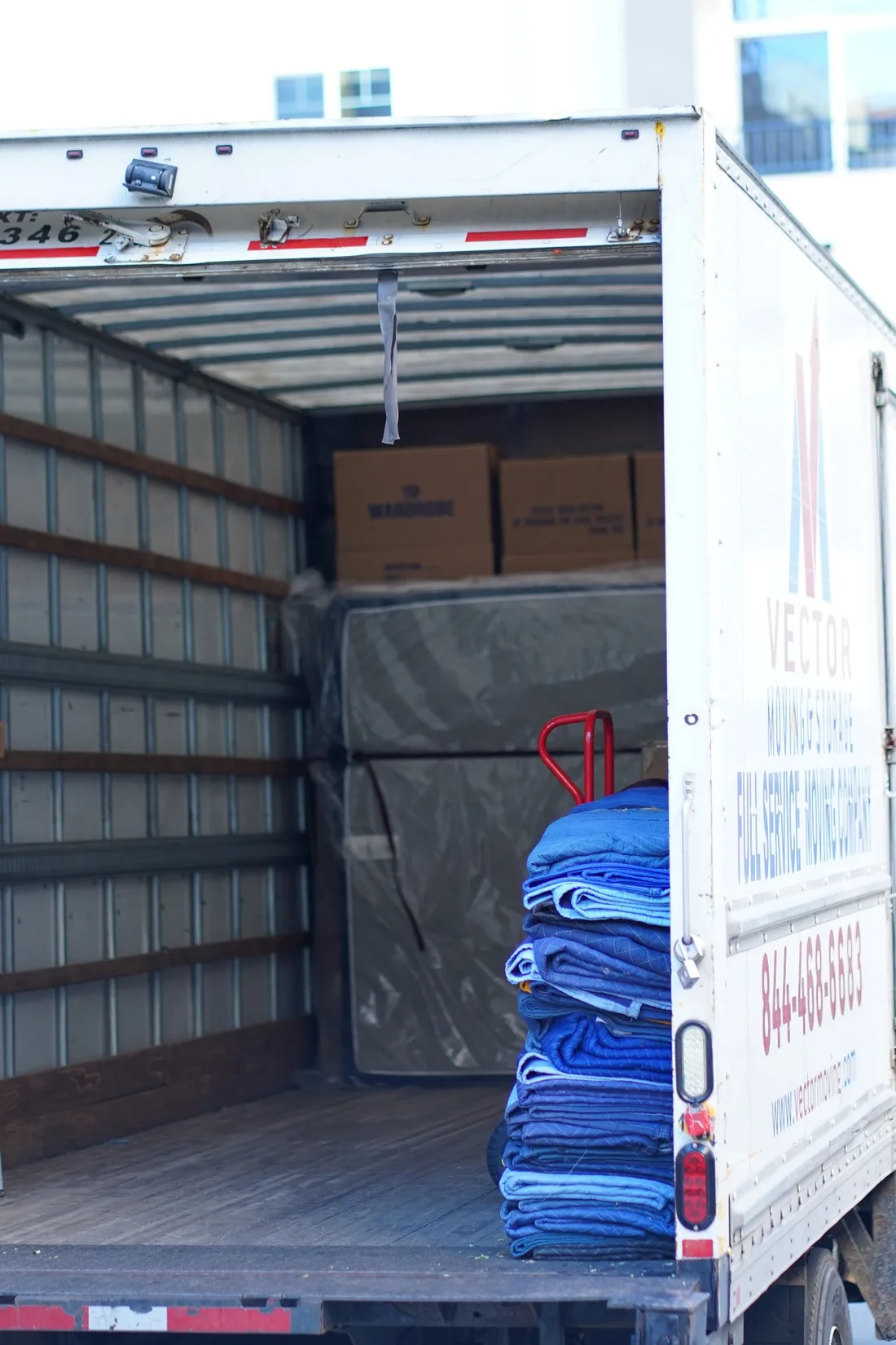 Prepared Vector moving truck with blankets, a dolly and protected furniture