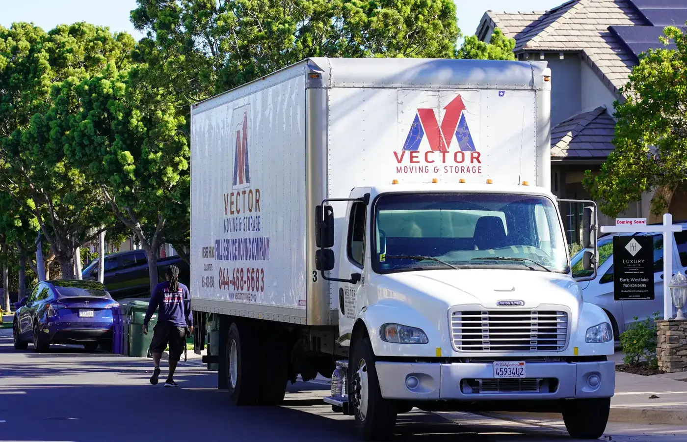 Vector moving truck positioned on a San Diego residential street