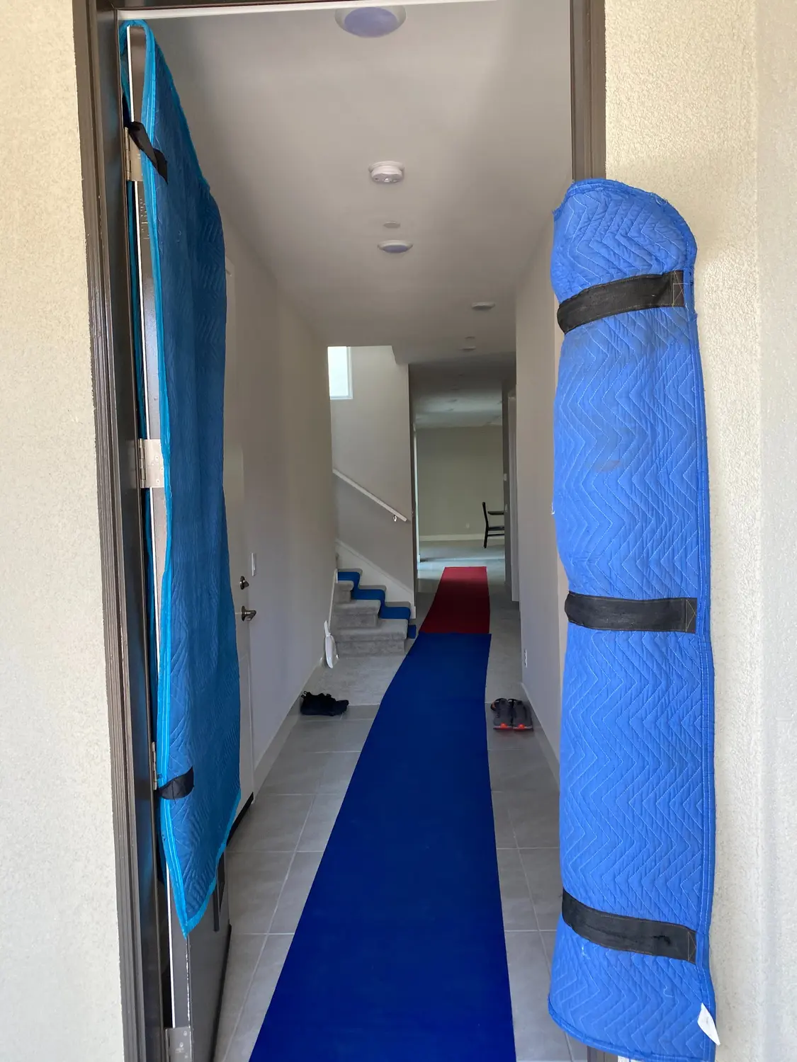 Doorway and floor protection prepared before a Vector move