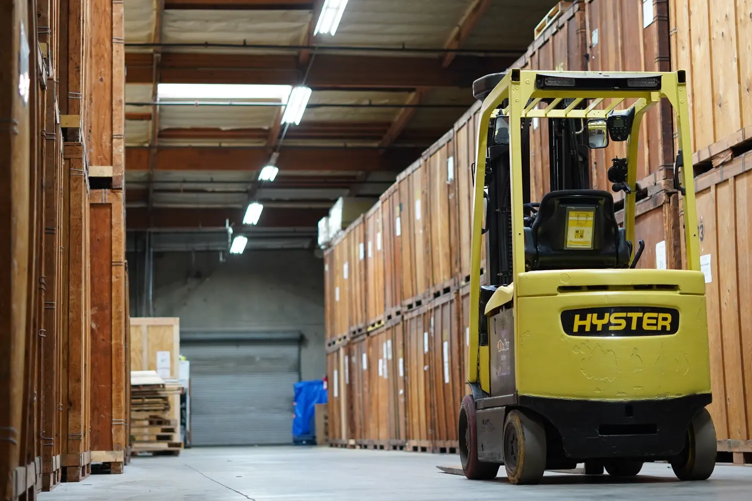 Warehouse storage containers and forklift used in Vector moving operations